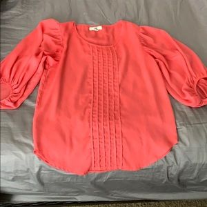 Coral top. With front detail. 3/4 bell sleeves.